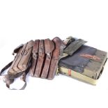 Five M56 magazine pouches, each having four compartments, together with two RPG carry packs, one for