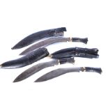 A large Middle Eastern Kukri, complete with sheath, missing smaller knives, together with two