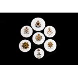 A group of seven early Aynsley china military crested discs, comprising Coldstream Guards, 10th