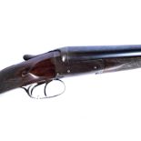 An E West & Son side by side 12 bore shotgun, having makers name to barrel and side of decorative