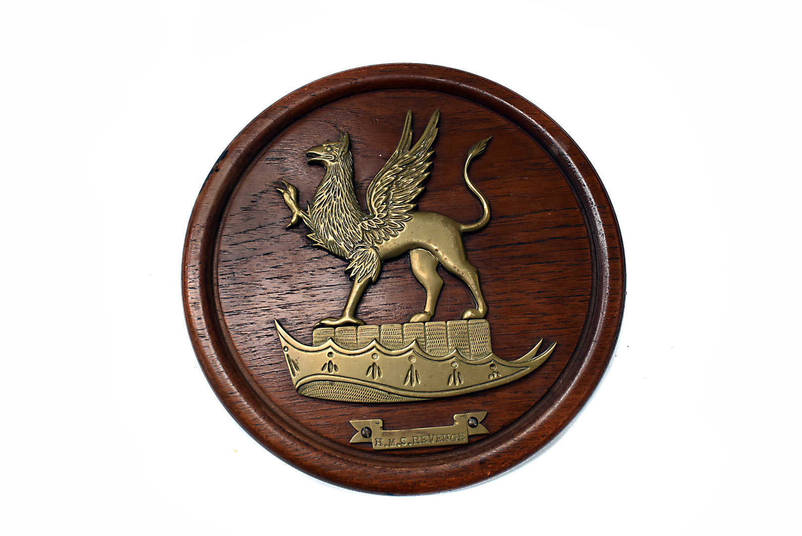 A brass and wooden wall plaque for H.M.S Revenge, this was acquired by a friend of the vendor who