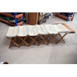 A mid 20th Century 'All British' fold out camp bed, having concertina wooden frame with canvas