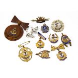 A selection of Royal Navy sweetheart brooches, mainly gilt with enamel decoration, unmarked to