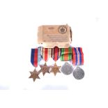 A WWII medal group, awarded to R Wardle, comprising War and Defence medal, 1939-45 Star, Africa Star