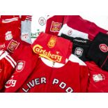 Liverpool FC Kit, Eleven shirts from various years and different sizes, red - Standard Chartered ,