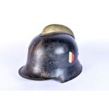 A WWII German Fire Brigade Helmet, comb fitted to the civilian patterned helmet, National tri-colour
