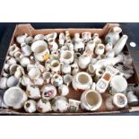 An extensive collection of crested china, in various forms, with British crests, including place