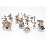 Ten Chinese white metal miniature figures, six figures carrying items, four with hand carts, one