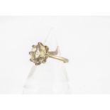 A 9ct gold citrine dress ring, the octagonal cut citrine in claw setting on basket gallery and