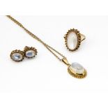 A collection of moonstone and gold jewellery, including a pair of ear studs, matching ring, ring