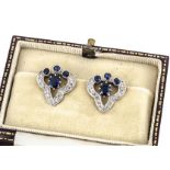 A pair of diamond and sapphire Belle Epoque clip ear studs, of trefoil form with central oval