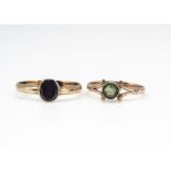 A peridot gold dress ring, marked 9ct, ring size K, and an early 19th Century garnet posey ring,