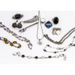 A collection of silver jewellery, including an onyx and marcasite dress ring, a pair of Maltese