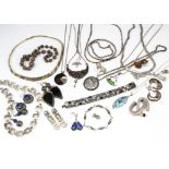 A collection of silver jewellery, including a graduated filigree bead style necklace, various