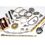 A quantity of costume jewels, including two bangles a curb link bracelet, a bar brooch with the name