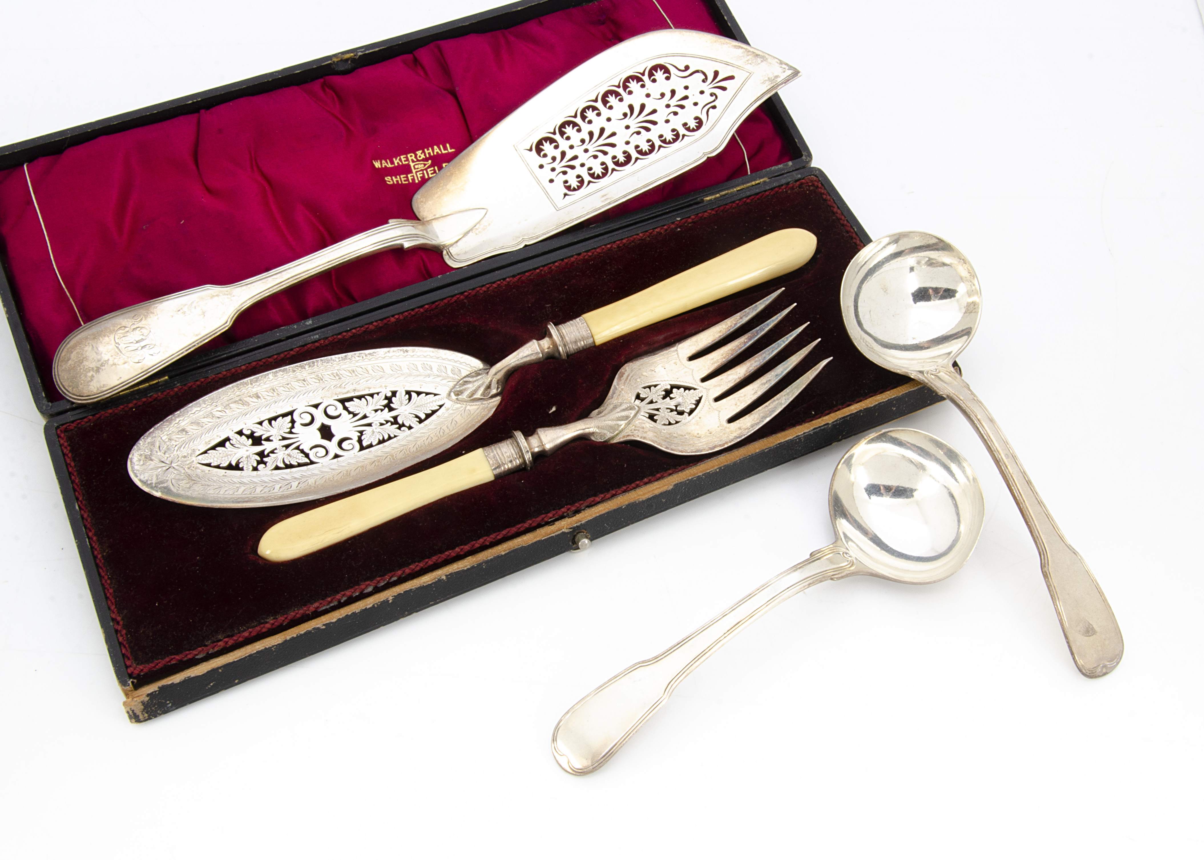 A pair of George III silver fiddle and thread pattern sauce ladles by William Eley & William