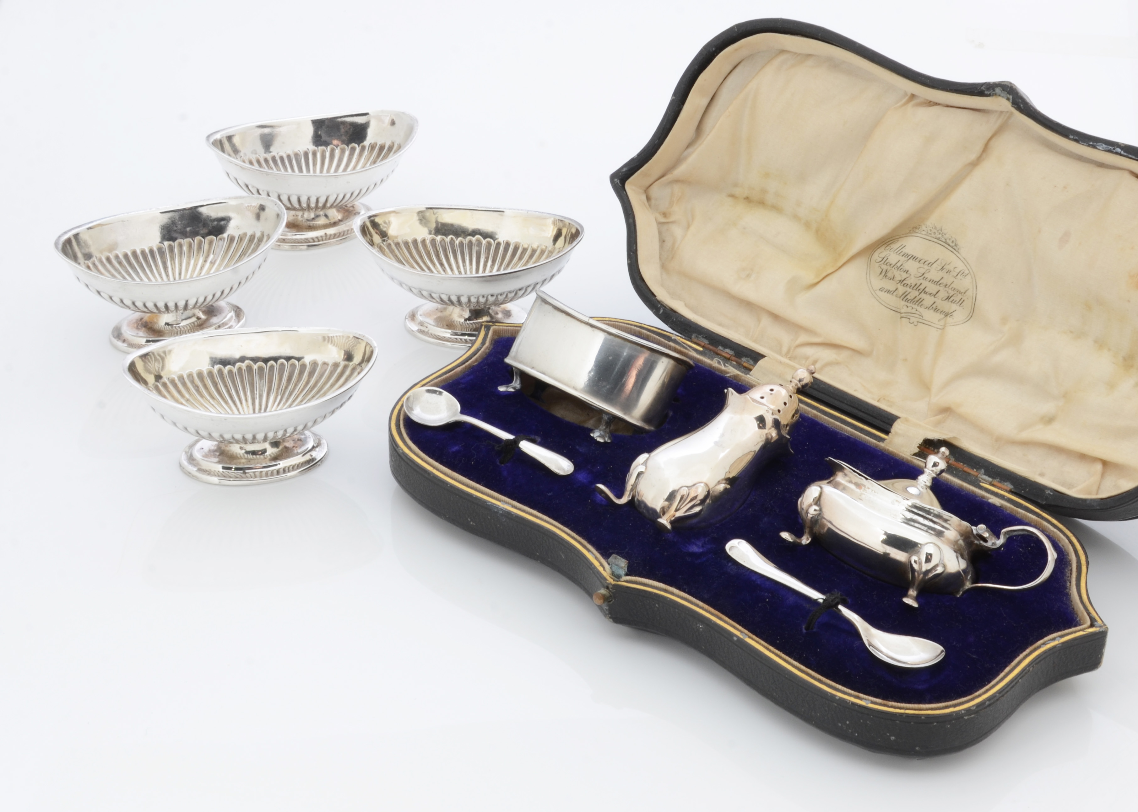 A set of four Victorian elliptical footed table salts by Charles Boynton, together with a cased part