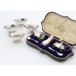 A set of four Victorian elliptical footed table salts by Charles Boynton, together with a cased part