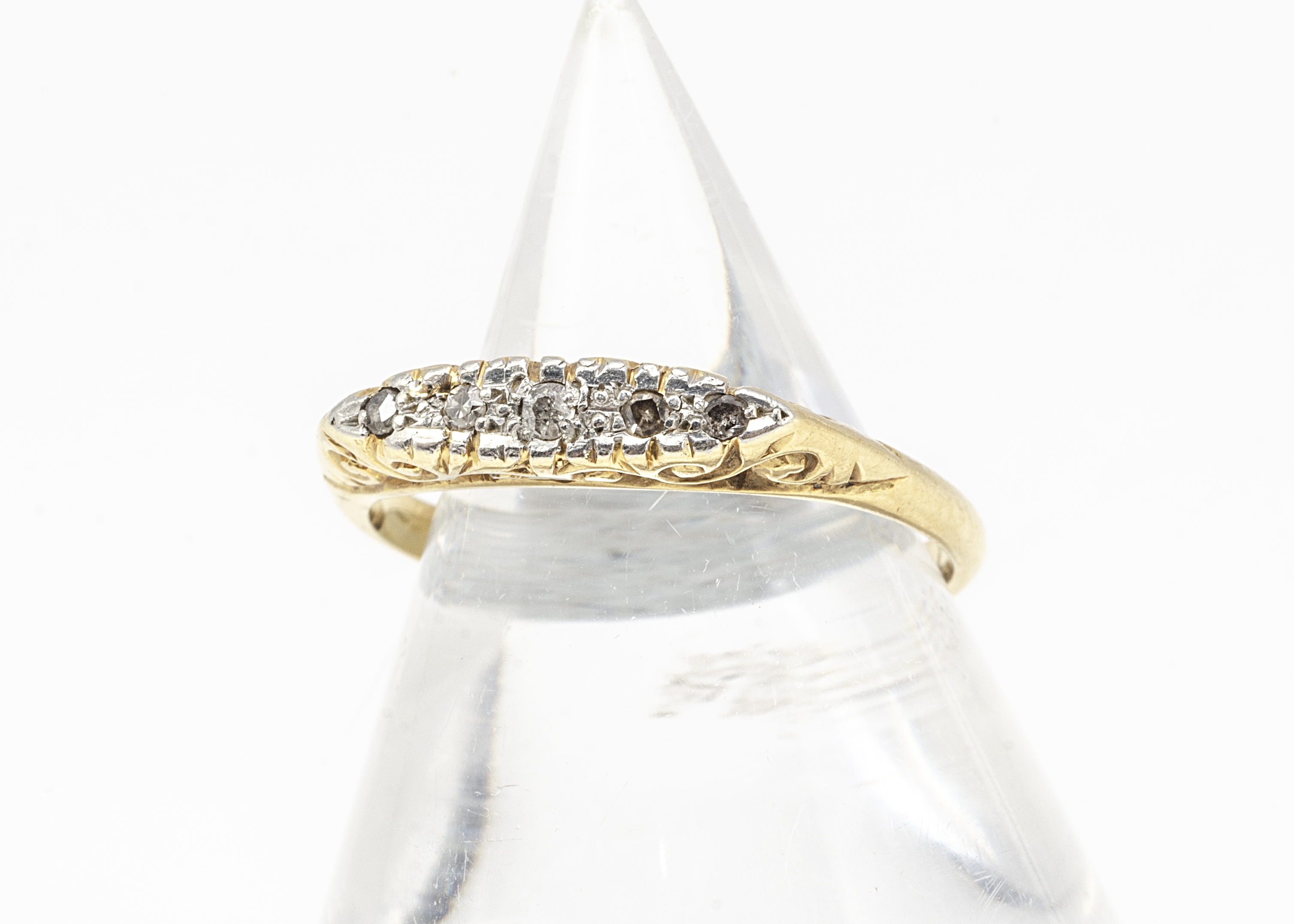 A five stone diamond 18ct gold and platinum dress ring, the five eight cuts within platinum on a