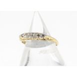 A five stone diamond 18ct gold and platinum dress ring, the five eight cuts within platinum on a