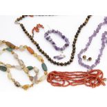 A tiger's eye bead necklace and earrings, together with various other coral and hardstone necklaces