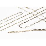 A collection of 9ct gold chains, including an expanding 9ct gold watch strap, a flattened curb