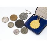 A small collection of coins and medallions, including an Edward VII coronation medallion, a