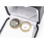 A pair of continental yellow metal mabe pearl and diamond clip earrings, in grey and cream, 2.1cm