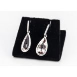 A pair of morganite and diamond drop earrings, the tear cut beryl drops on diamond set rectangular