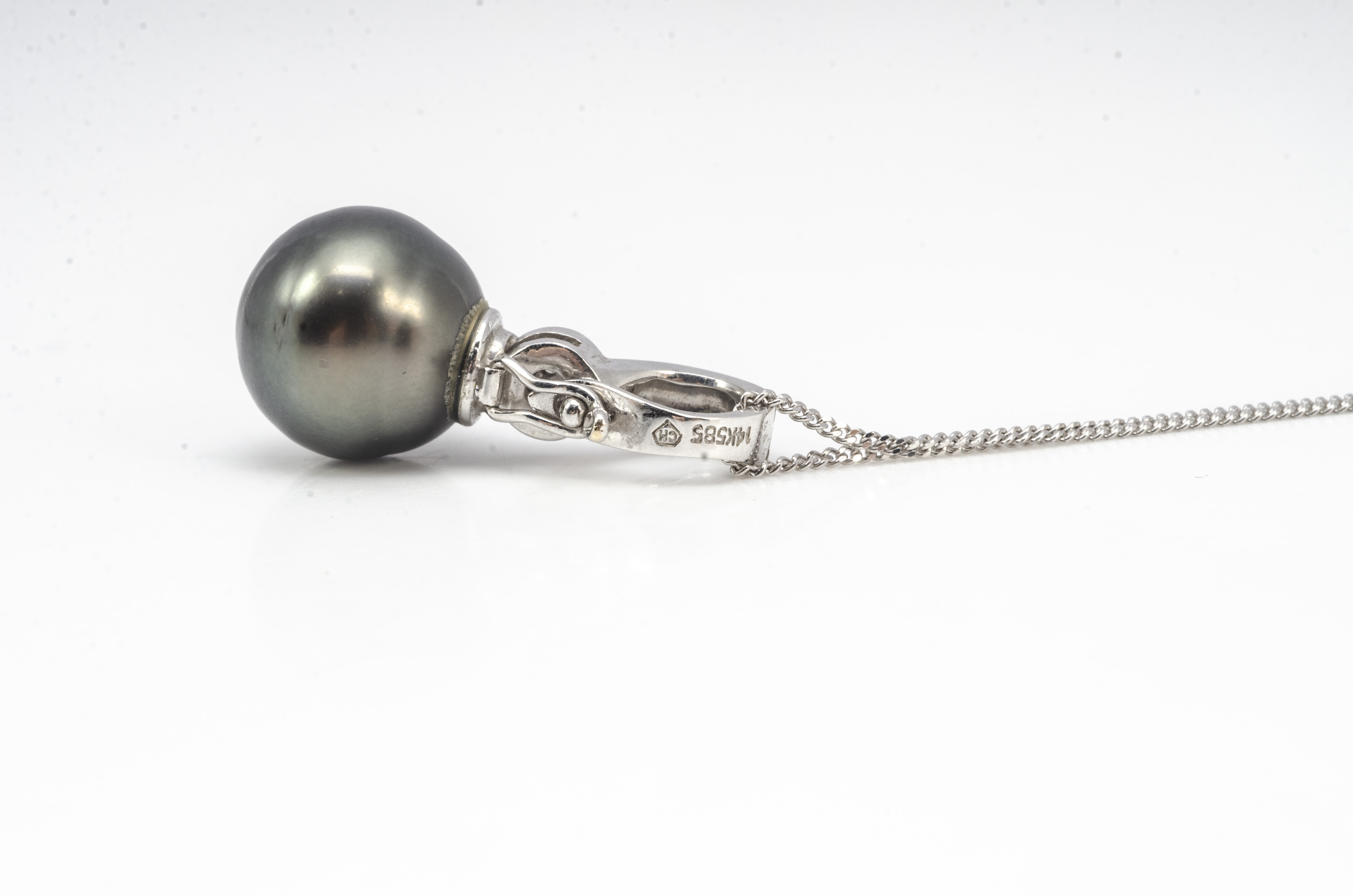 A cultured black pearl and diamond drop pendant, in white metal marked 14k 585 on a fine 9ct white - Image 2 of 2