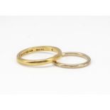 A 22ct gold D shaped wedding band, ring size V 1/2, 5.6g together with a 9ct gold circular wedding