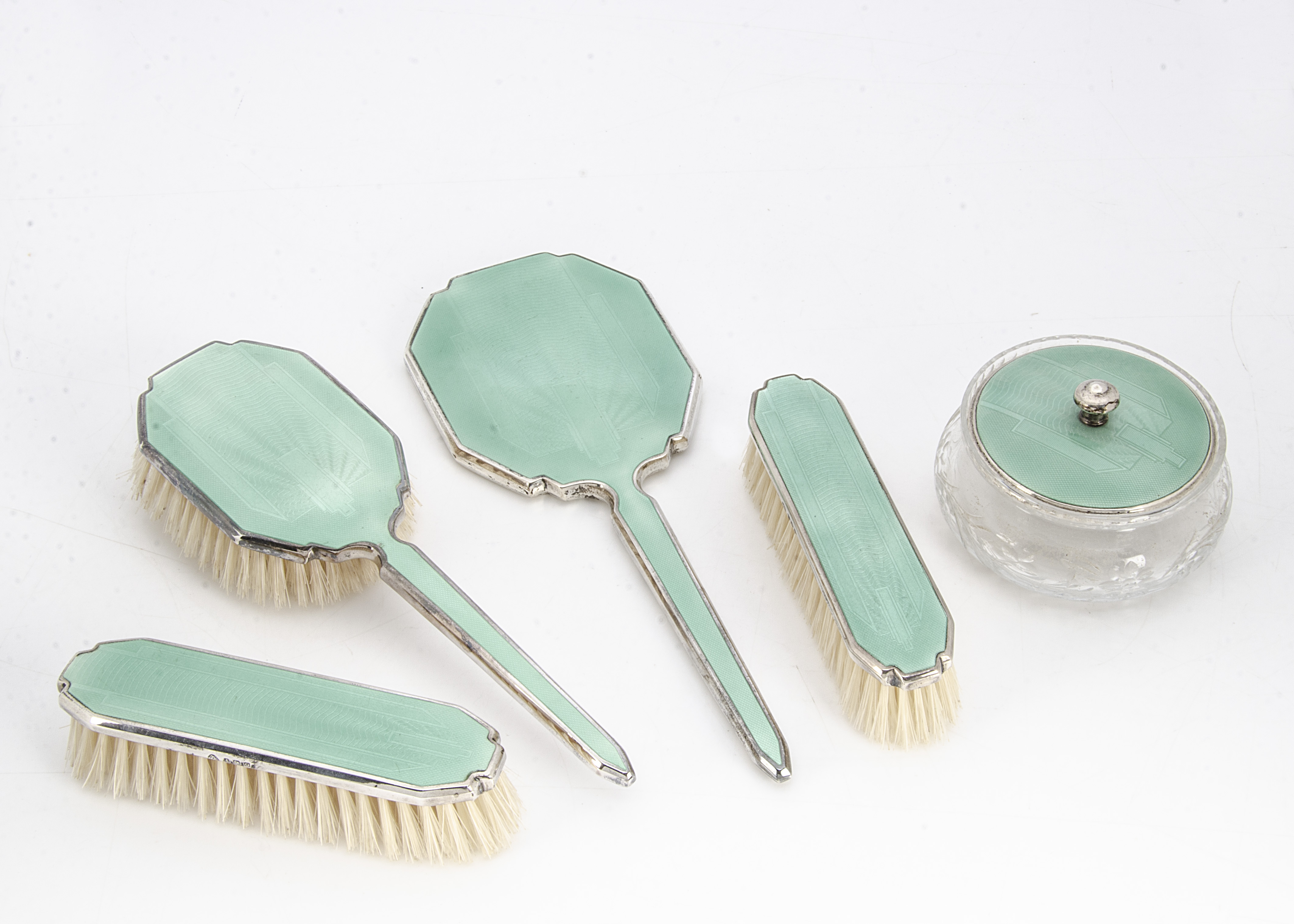 An Art Deco period silver and enamelled dressing table set by Adie Bros, comprising powder puff pot,