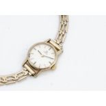 A c1960s Omega 9ct gold cased lady's wristwatch, 19mm, presented on a 9ct gold bracelet, 14.4g