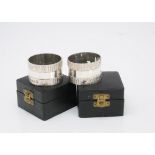 A pair of 1970s silver napkin rings by Gerald Benney, circular, 4.5cm diameter, with textured band