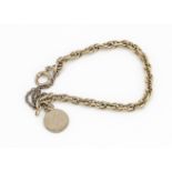 A 9ct gold Prince of Wales linked bracelet, with disc charm, 14cm, 6.2g