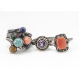 Three contemporary silver rings, including a multi gem set example set with cabochon turquoise,