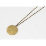 A George III 1784 spade guinea pendant, on a gilt metal chain, pendant 8.5g, 2.4cm diameter
