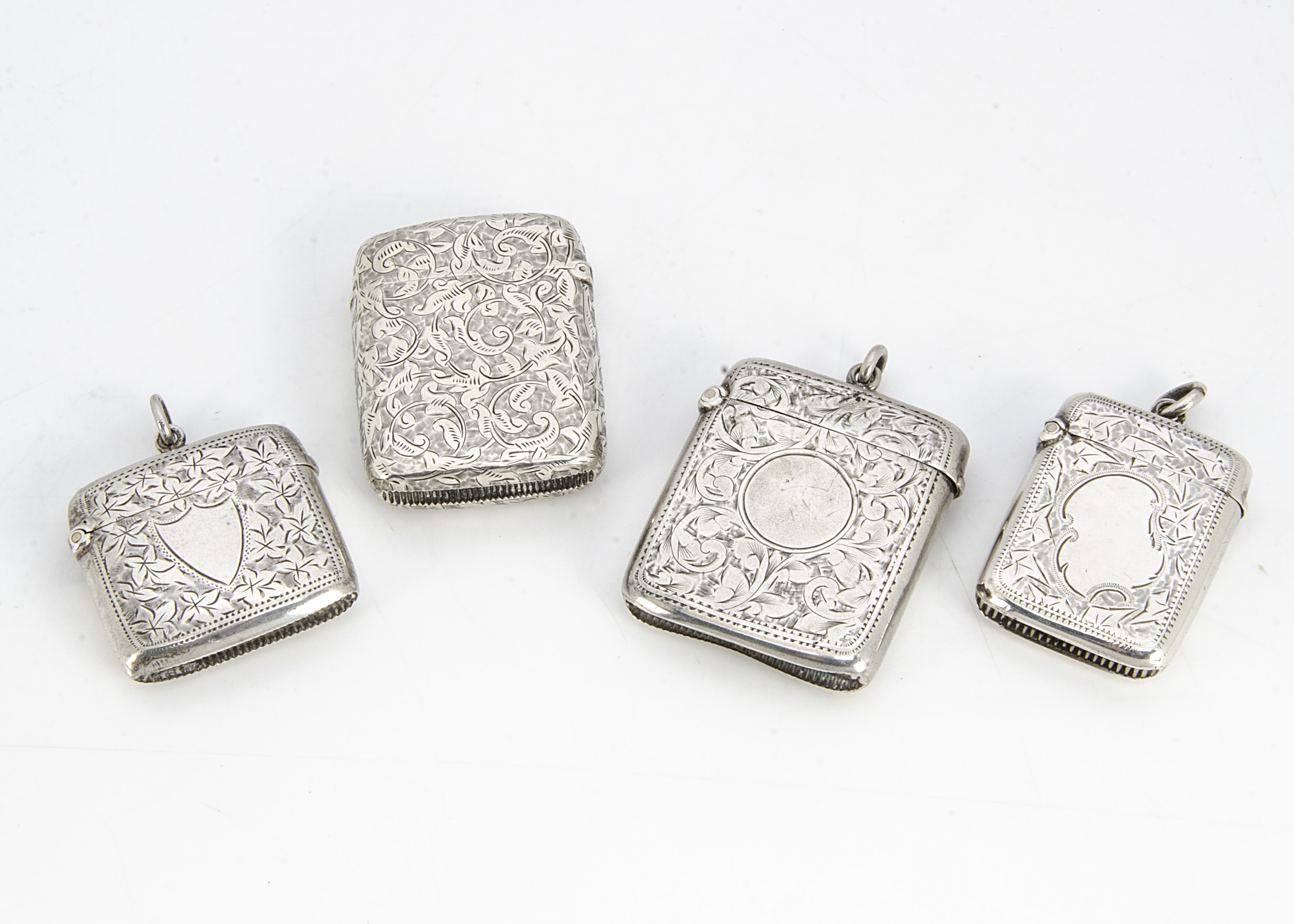 Four Victorian and later silver vesta cases, each engraved, three with fob loops, 5.5cm to 4.3cm (4)