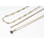 A 9ct gold curb link chain, amethyst pendant on a fine curb link chain and another gold chain, 11g