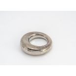 A Georg Jensen silver circular ring, of tapered bulbous form, impressed factory marks to inner shank