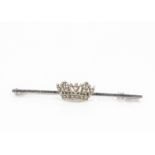 A Royal Naval 9ct gold sweetheart brooch, the diamond set naval crown on plain white 9ct gold bar,