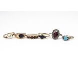 A collection of 9ct gold dress rings, including a five stone garnet ring, a garnet signet ring,