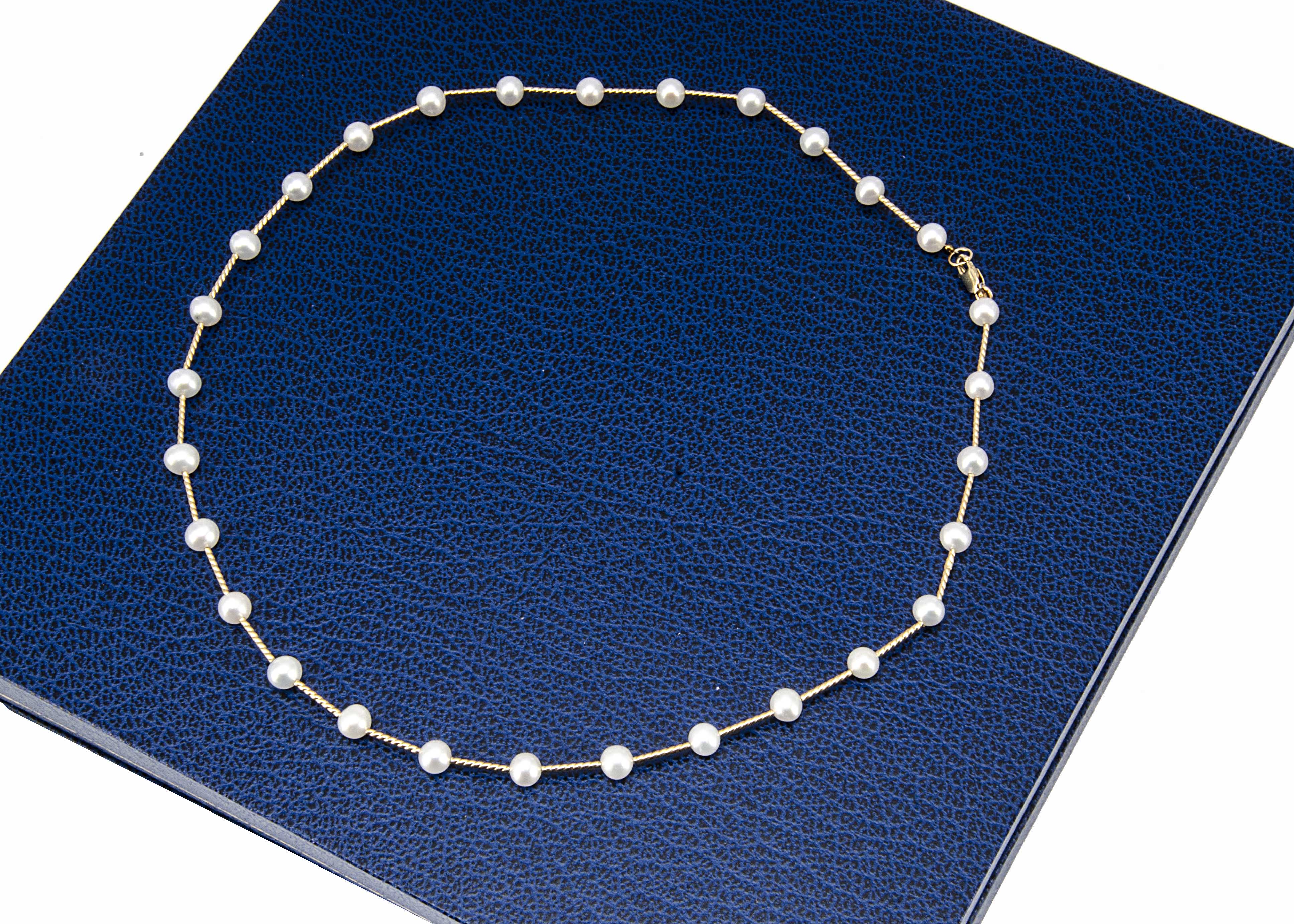 A cultured pearl and 14ct gold choker necklace, the cultured pearls of irregular shape on a gold