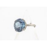 A 9ct gold and blue paste set dress ring, the circular cut paste stone in claw setting, ring size J,