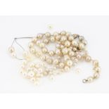 A string of cultured baroque pearls, 6.6mm knotted strung, 38cm, together with another uniform