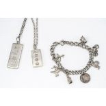 A collection of silver jewellery, including two hallmarked ingots and a silver curb link charm