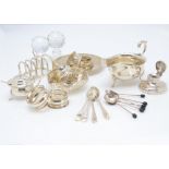 A collection of Victorian and 20th Century silver, including a sauce boat, toast rack, bon bon dish,