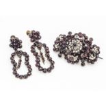 A Bohemian late 19th Century base metal garnet and seed pearl brooch, af, 5.2cm x 3.5cm together