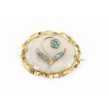 A Victorian agate and turquoise oval brooch, the pinchbeck mounted oval agate in a milky white