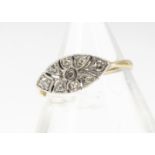 An Art Deco 18ct gold and platinum diamond set dress ring, of fan design, with eight cut diamonds,